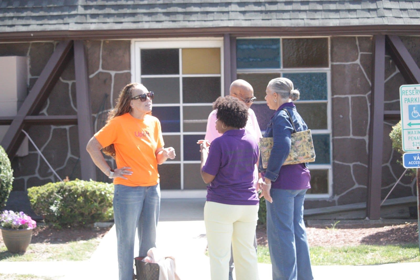 Members chatting outside the fellowship hall
