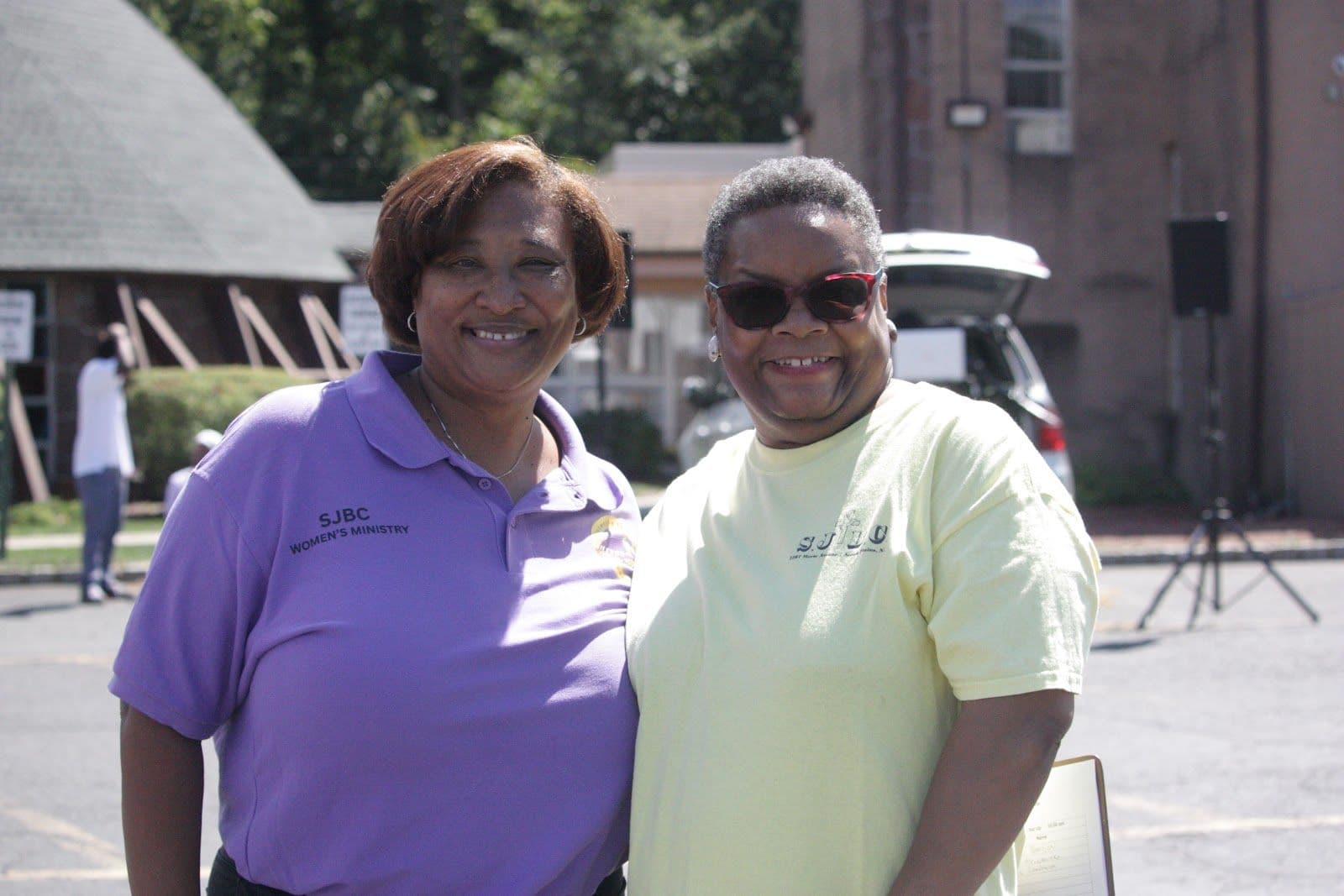 Two women smiling at a fellowship event